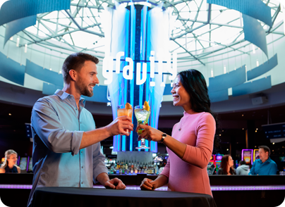 Couple cheers outside the gravity bar located in the center of North Star Mohican Casino Resort.