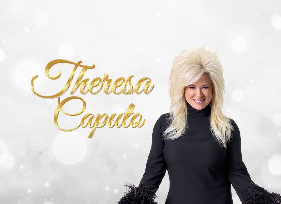"Theresa Caputo" Theresa Caputo posing in front of a orb background.